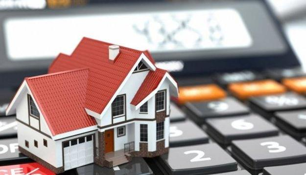 От чего зависит налог на недвижимое имущество: сколько нужно будет платить за квартиры и дома