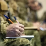 військові