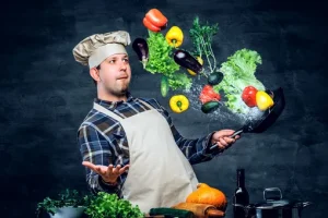 повар с овощами