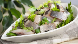 засолений оселедець